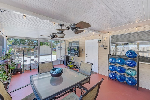 sunroom / solarium with wooden ceiling and ceiling fan