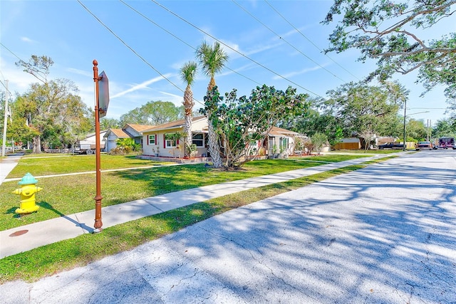 bungalow-style house featuring a front yard