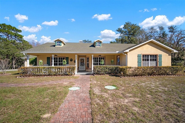 ranch-style home featuring a porch and a front yard