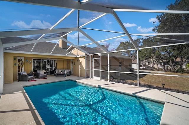 view of pool featuring a lanai, an outdoor living space, and a patio