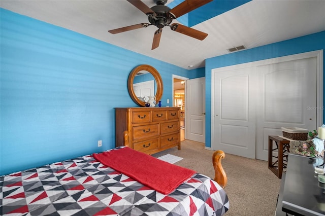 unfurnished bedroom featuring ceiling fan, a closet, and carpet