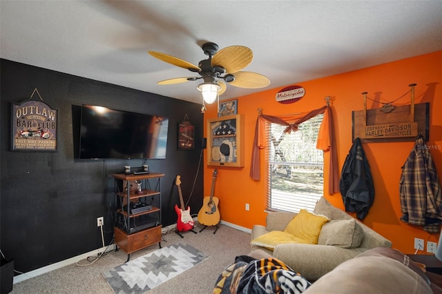 living room with ceiling fan and carpet