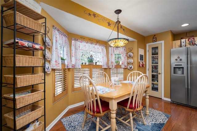 dining area with dark wood-type flooring