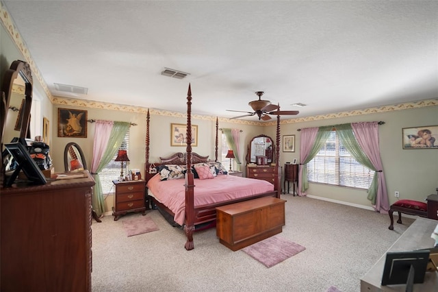 bedroom with ceiling fan and light colored carpet