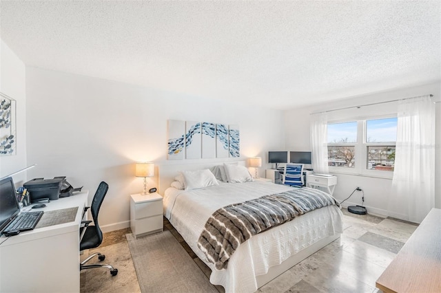 bedroom featuring a textured ceiling