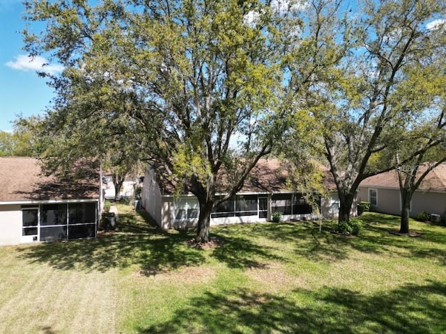 view of yard featuring a sunroom