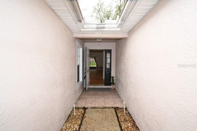 property entrance featuring stucco siding