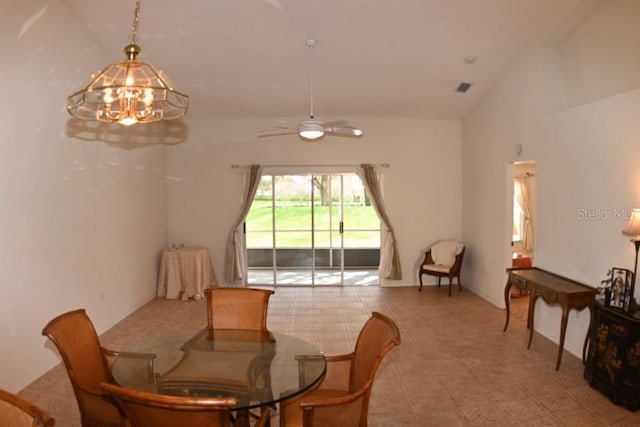 dining room with a ceiling fan, visible vents, and vaulted ceiling