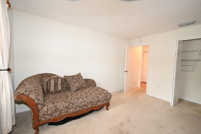 living area with carpet and visible vents