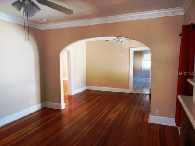 unfurnished room with crown molding, dark wood-type flooring, and ceiling fan