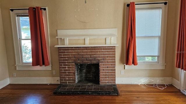 room details featuring hardwood / wood-style floors and a fireplace