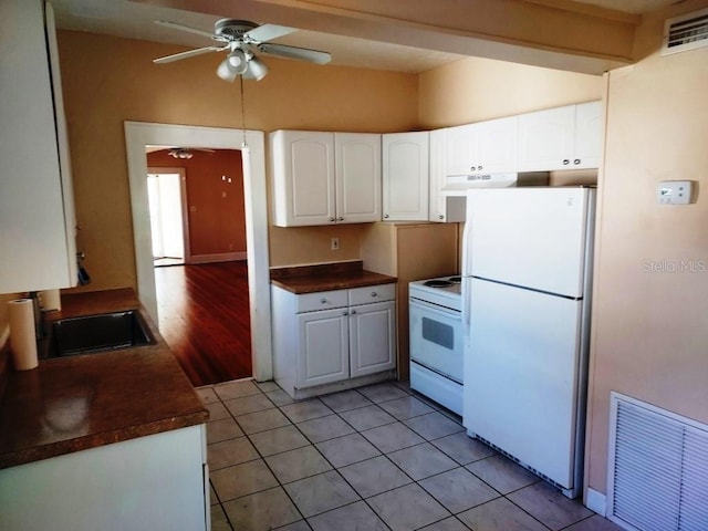 kitchen featuring light tile patterned floors, white appliances, white cabinets, and ceiling fan