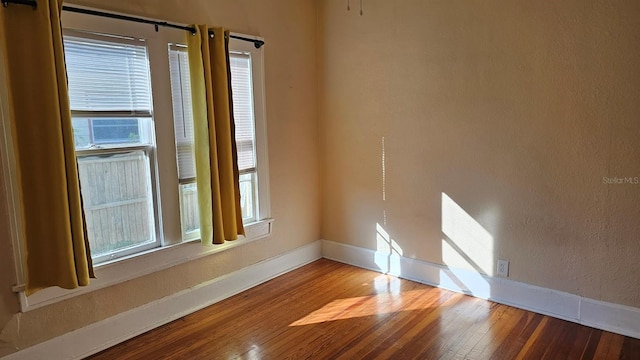 unfurnished room featuring wood-type flooring