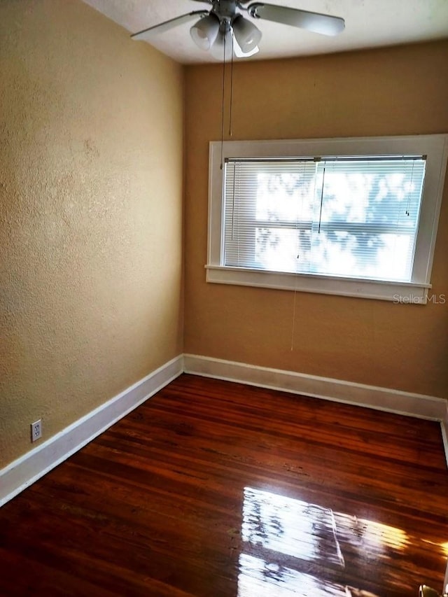 unfurnished room featuring ceiling fan and wood-type flooring