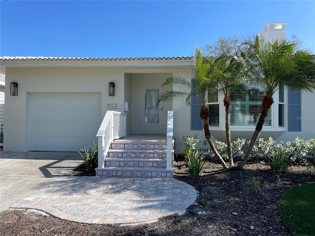 property entrance with a garage