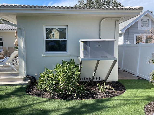 view of home's exterior with a lawn