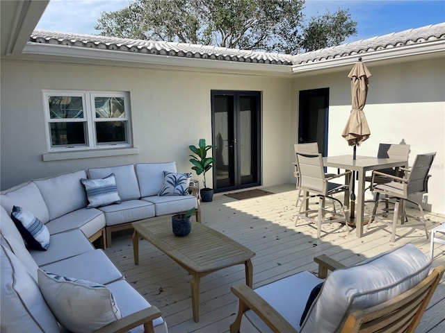 wooden deck featuring an outdoor hangout area