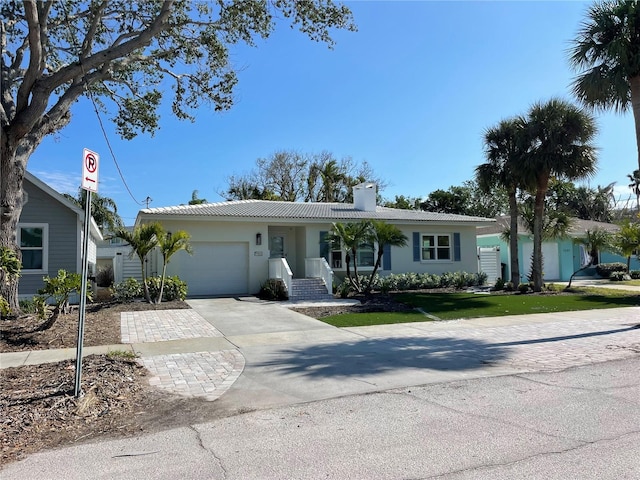 single story home featuring a garage