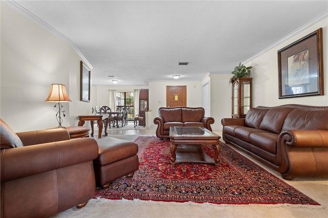 carpeted living room with ornamental molding