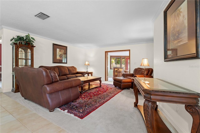 living room featuring light tile patterned floors and ornamental molding