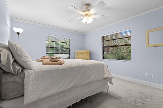 bedroom featuring ceiling fan, carpet, and ornamental molding