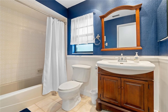 full bathroom featuring toilet, tile patterned floors, shower / bath combo, and vanity