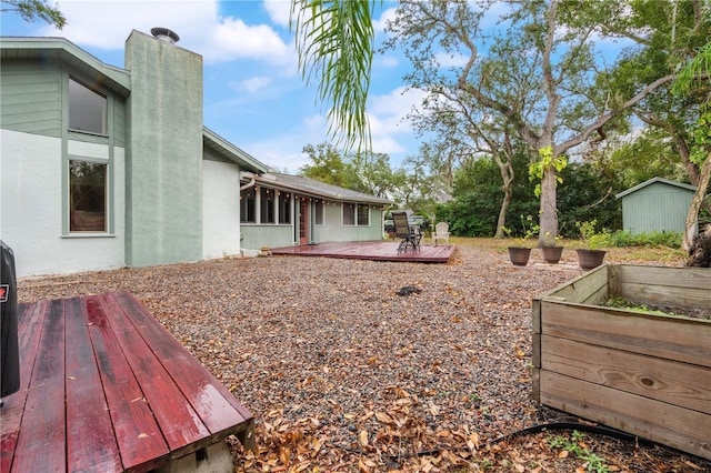 view of yard with a wooden deck