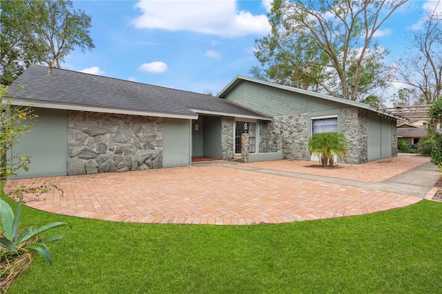 view of front of property with a front lawn and a patio