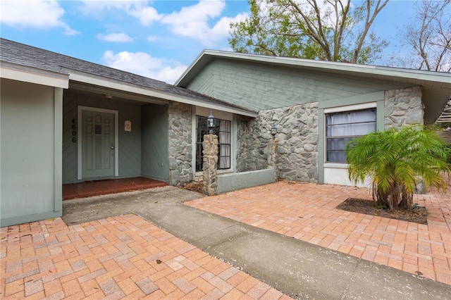 entrance to property featuring a patio area