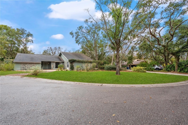 ranch-style home with a front yard