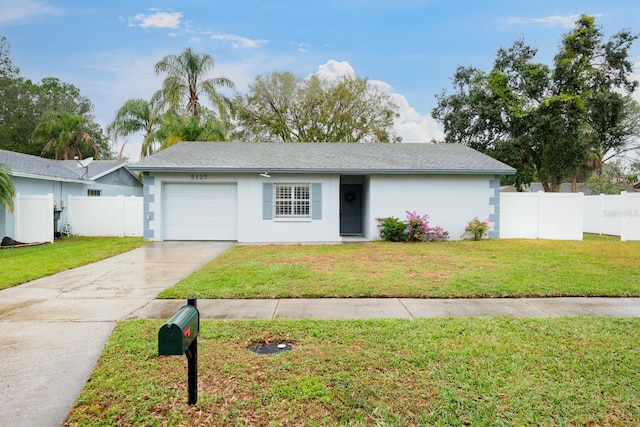 single story home featuring a front lawn