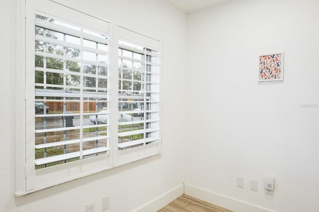 spare room featuring light hardwood / wood-style floors