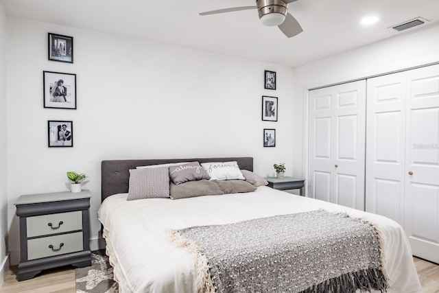 bedroom featuring a closet, ceiling fan, and light hardwood / wood-style floors