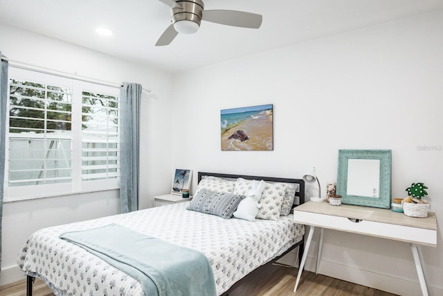 bedroom featuring hardwood / wood-style floors and ceiling fan