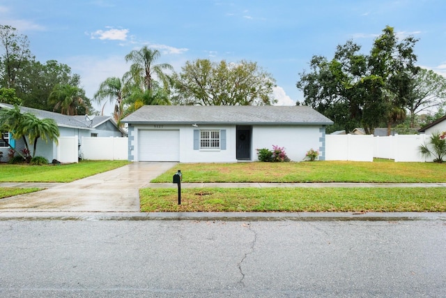 single story home with a garage and a front yard