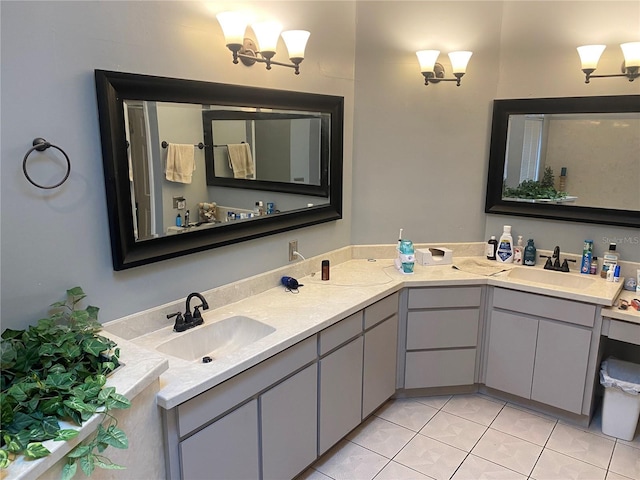 full bathroom featuring double vanity, a sink, and tile patterned floors