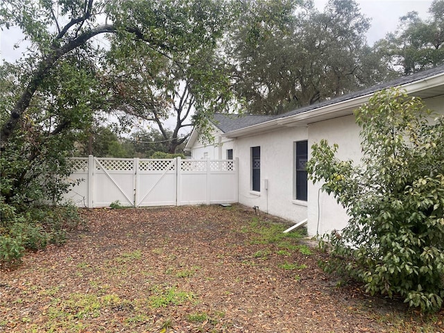 view of yard featuring a gate and fence