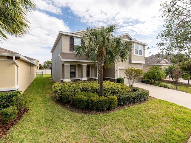 view of front of home featuring a garage and a front yard