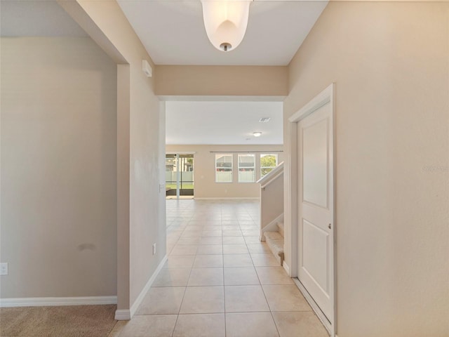 corridor featuring light tile patterned flooring