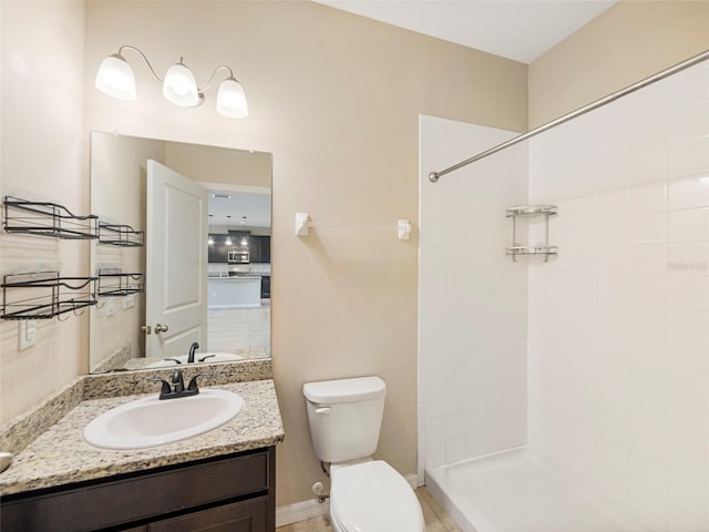 bathroom with vanity, toilet, and walk in shower