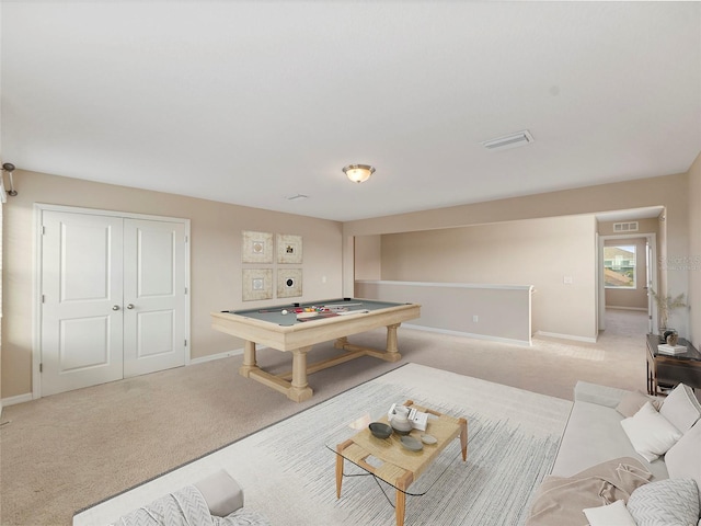 recreation room with light colored carpet and pool table