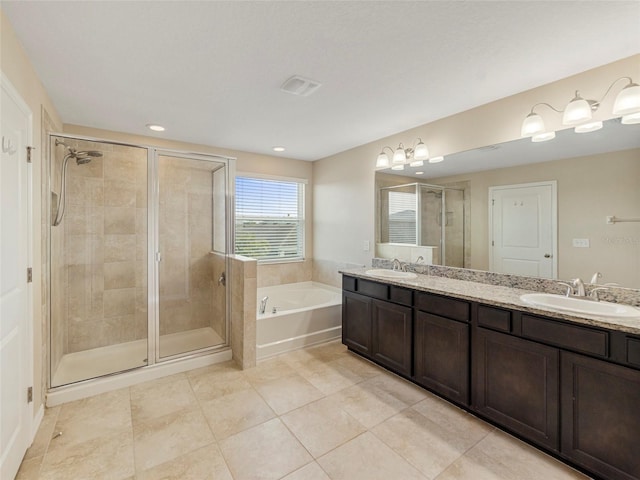 bathroom featuring tile patterned flooring, vanity, and plus walk in shower