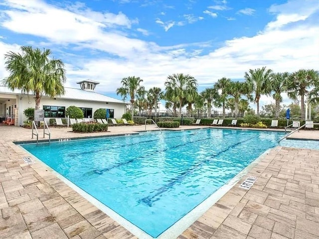 view of pool featuring a patio area