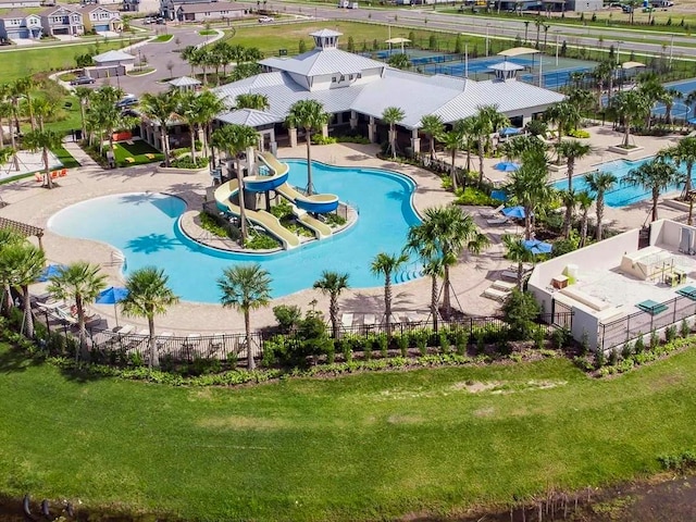 view of swimming pool with a water slide