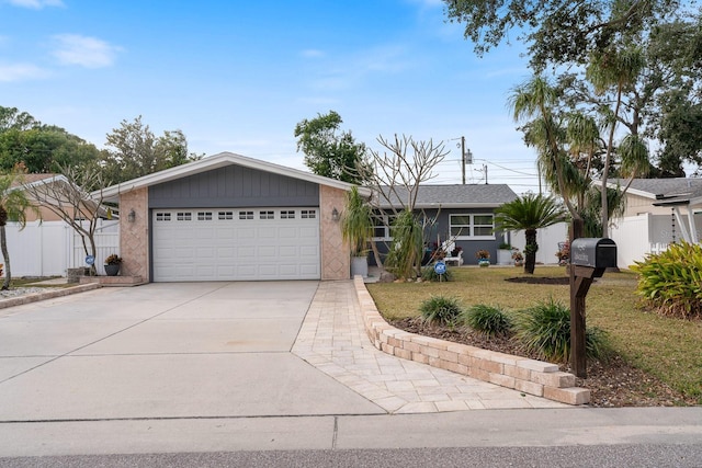 ranch-style home with a garage and a front lawn