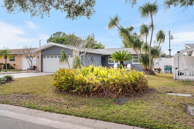 view of front facade featuring a garage and a front lawn