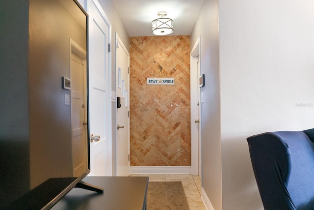 doorway featuring light tile patterned floors