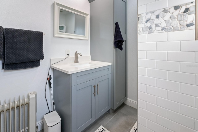 bathroom featuring vanity and radiator heating unit