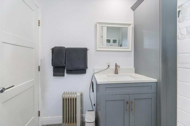 bathroom featuring vanity and radiator