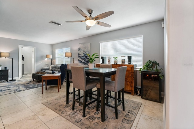 dining room featuring ceiling fan and light tile patterned floors